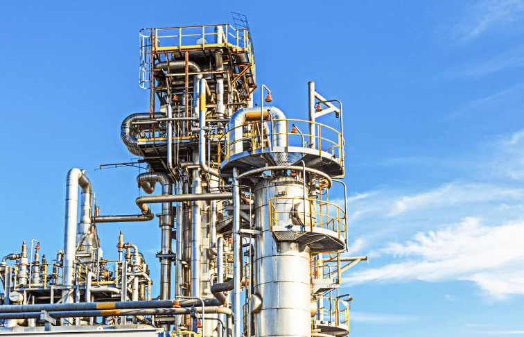 Industrial distillation column and piping at a chemical plant